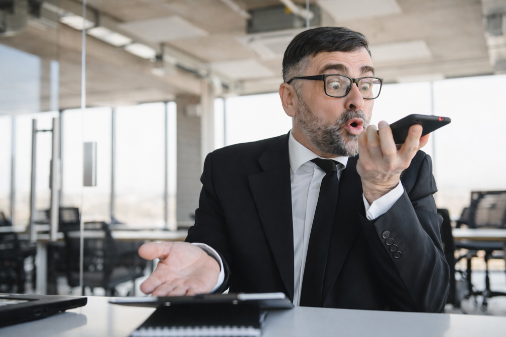 Professional man looking confused while listening to unclear English during a business conversation